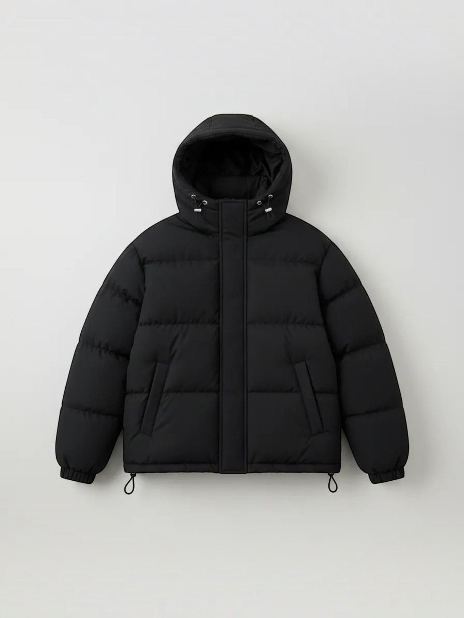 Chaqueta puffer negra unisex cozyvibe con capucha, diseño acolchado oversize y cierre frontal para invierno