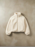Polerón cozyvibe de chiporro teddy color albaricoque con cuello alto y cierre frontal, estilo oversize casual.